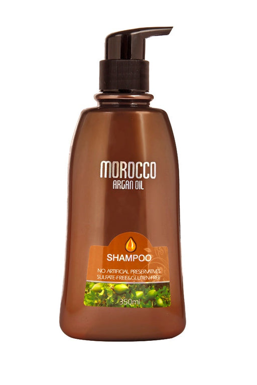 A bottle of Morocco Argan Oil Shampoo with a pump dispenser, brown in color with green tea and argan oil imagery on the label.