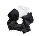 Black scrunchie with a brand tag on a light surface