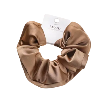 Brown scrunchie with a tag on a white background