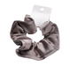 Brown scrunchie on a white surface with a measurement label