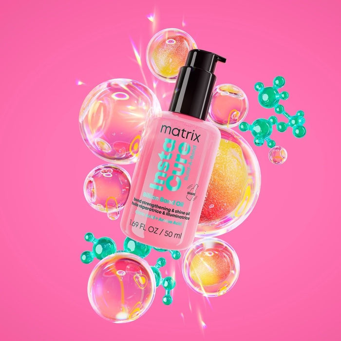 Pink bottle of Matrix hair product with colorful bubbles on a pink background