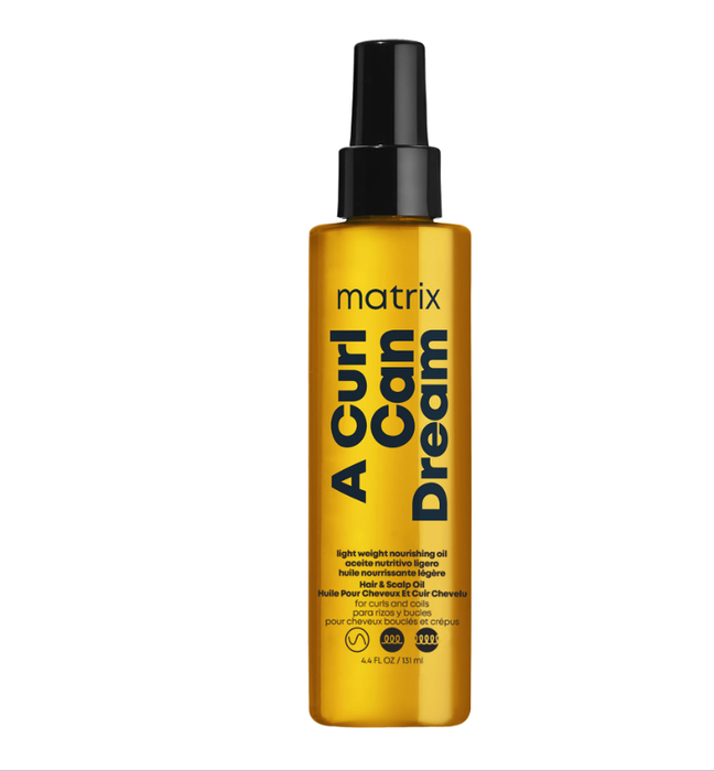 Yellow bottle of Matrix 'A Curl Can Dream' hair product on a white background