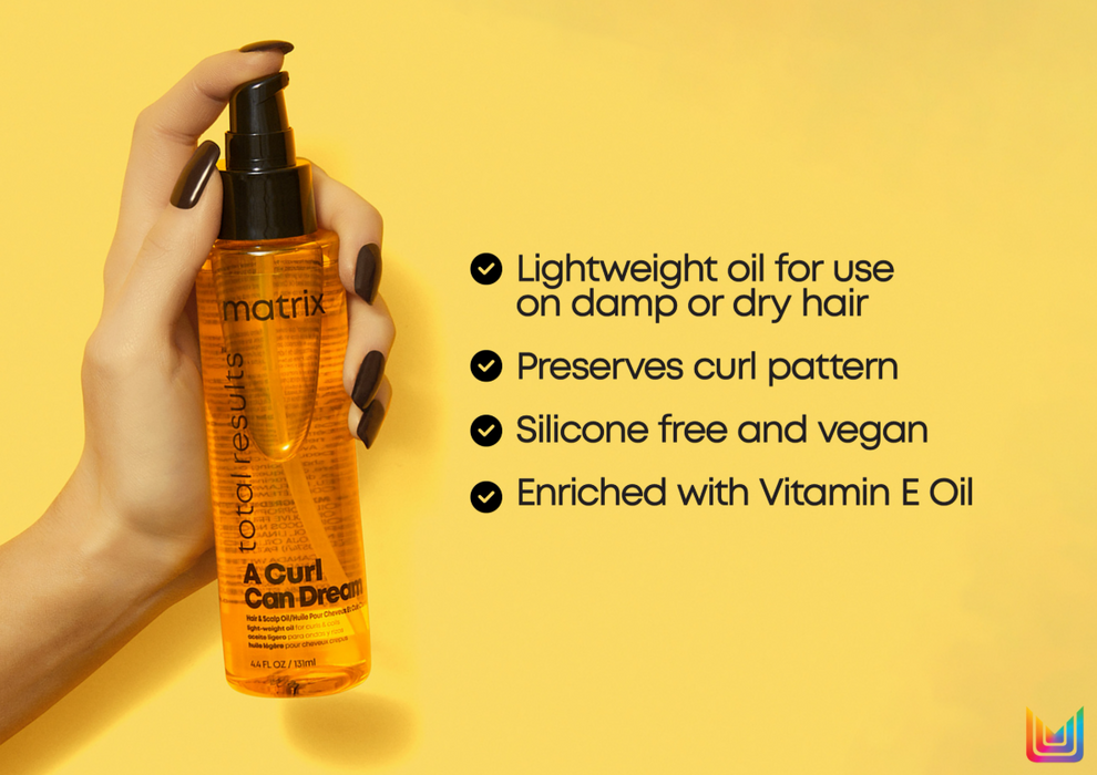 Hand holding a bottle of Matrix hair oil against a yellow background with product features listed.