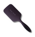 A dark purple rectangular hairbrush with a long handle, featuring the brand name 'NAK HAIR' printed in white on the upper left side, set against a plain white background.