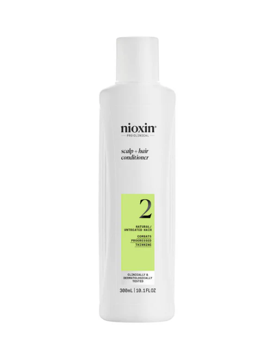 A bottle of Nioxin System 2 Scalp + Hair Conditioner, with a white and green label, containing 300ml of the product.