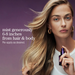 A woman with long blonde hair holds a small purple spray bottle against a solid purple background, with text reading 'mist generously 6-8 inches from hair & body Re-apply as desired.'.