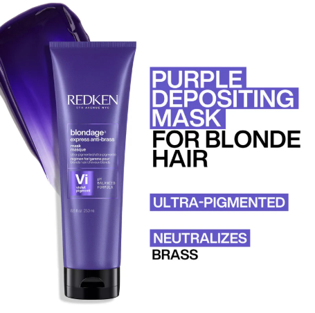Purple Redken hair mask tube with text on a white background