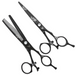 Set of black hairdressing scissors on a white background