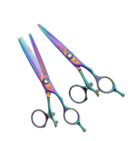 A set of colorful Washi brand hair shears with a swivel design, including a cutting shear, a thinner, and a purple razor, presented with a carrying case.